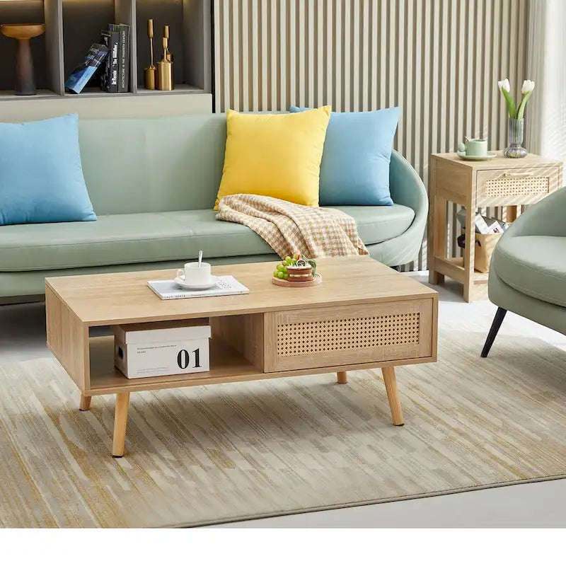 Table basse moderne avec panneau de porte en rotin tressé et pieds en bois massif