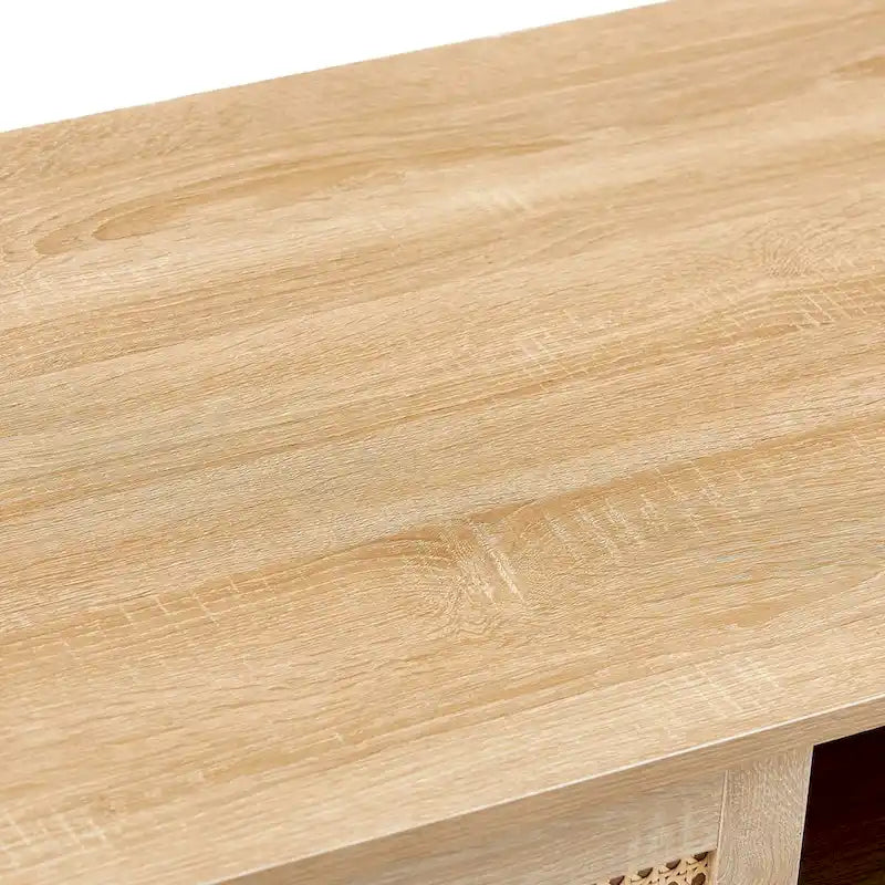 Table basse moderne avec panneau de porte en rotin tressé et pieds en bois massif